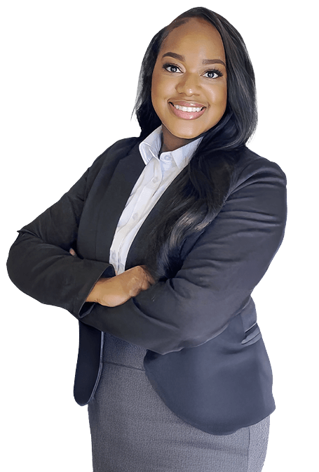 A woman in business attire with long dark hair smiles confidently, standing with arms crossed against a white background.