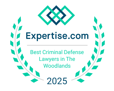 A badge with laurel leaves and a geometric design, reading "Expertise.com Best Criminal Defense Lawyers In The Woodlands 2025. A badge with laurel leaves and a geometric design, reading "Expertise.com Best Criminal Defense Lawyers In The Woodlands 2025.