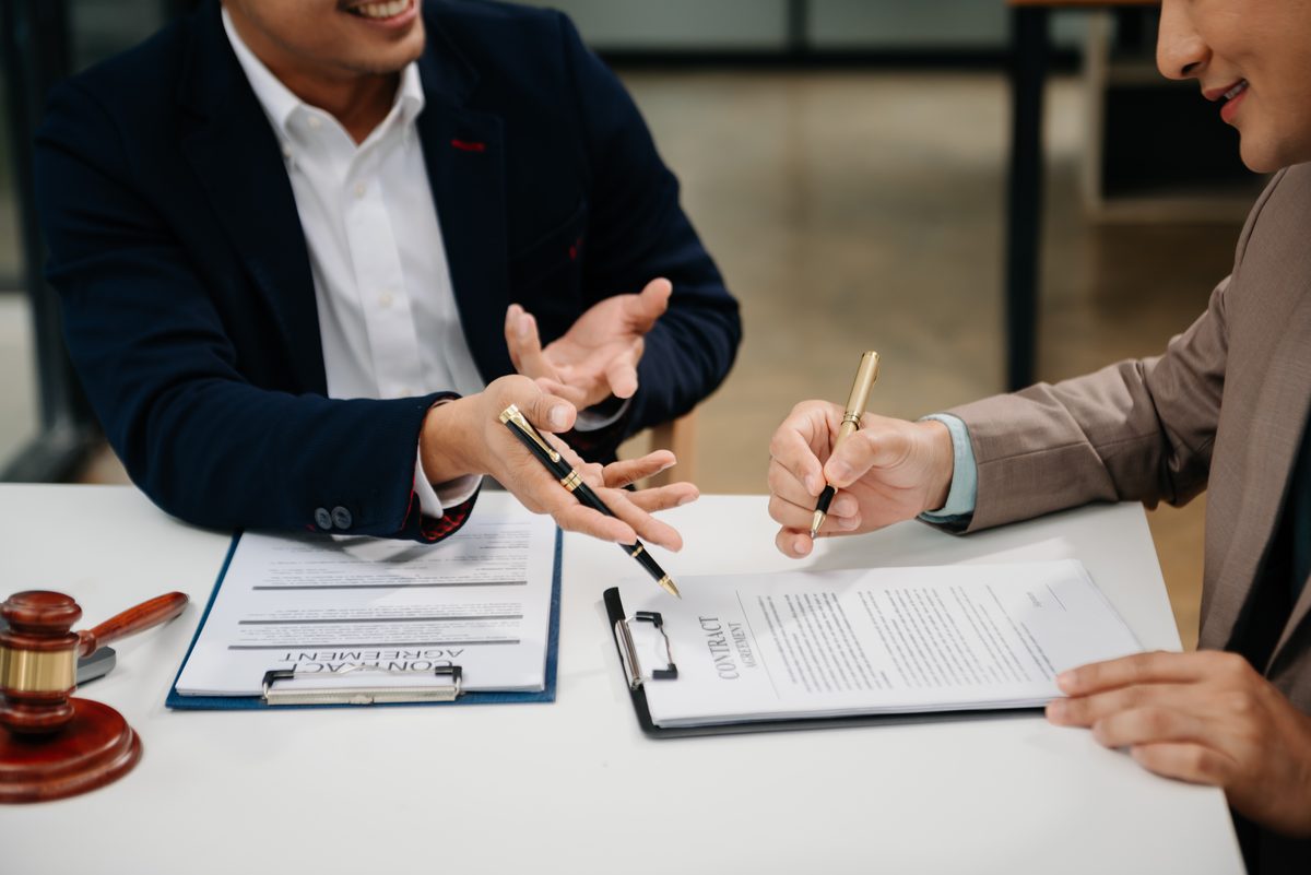 Attorney reviewing a protective order application with a client at a Texas law office