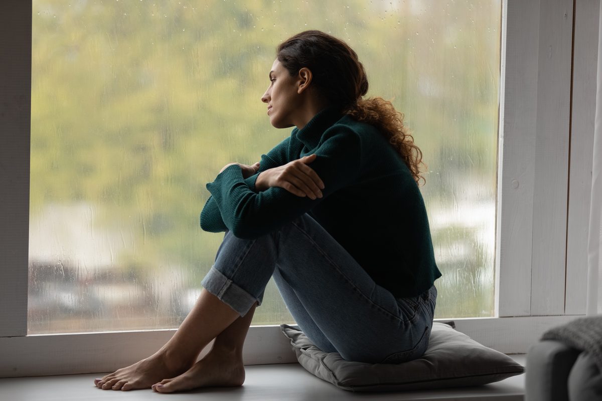 A young woman sits by a window, worried about what a first drug charge could mean A young woman sits by a window, worried about what a first drug charge could mean